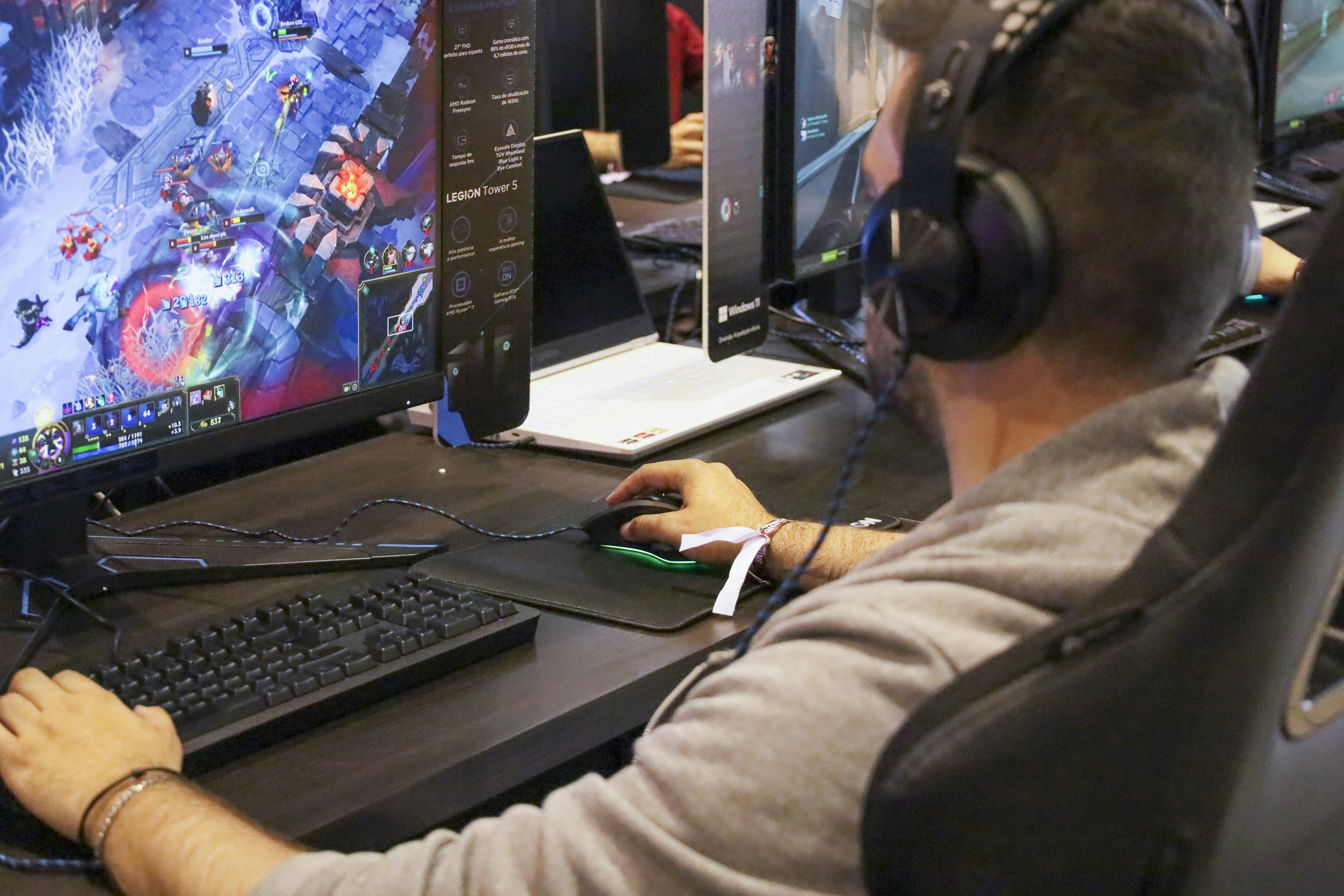 a man is playing a video game on a computer